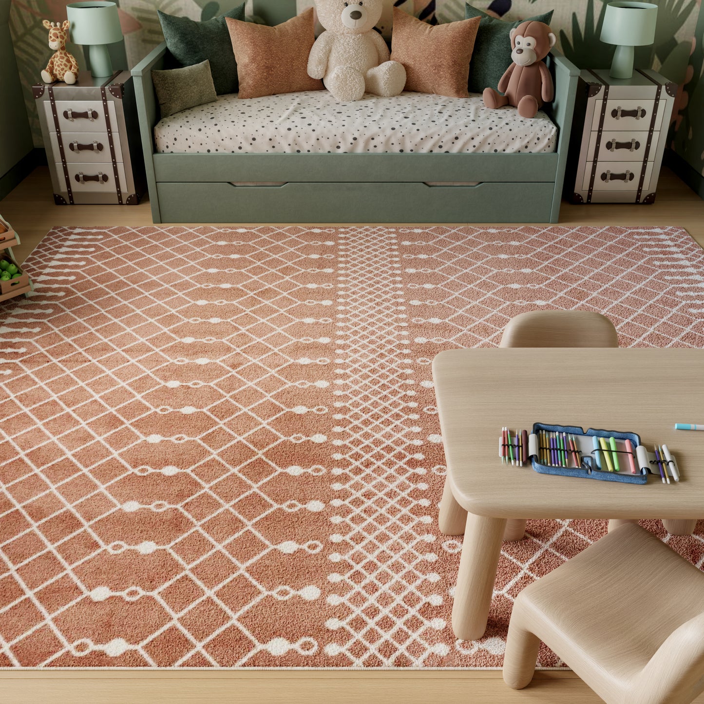 Soft pink kids' area rug with a white diamond lattice pattern; rectangular plush rug for playroom decor.
