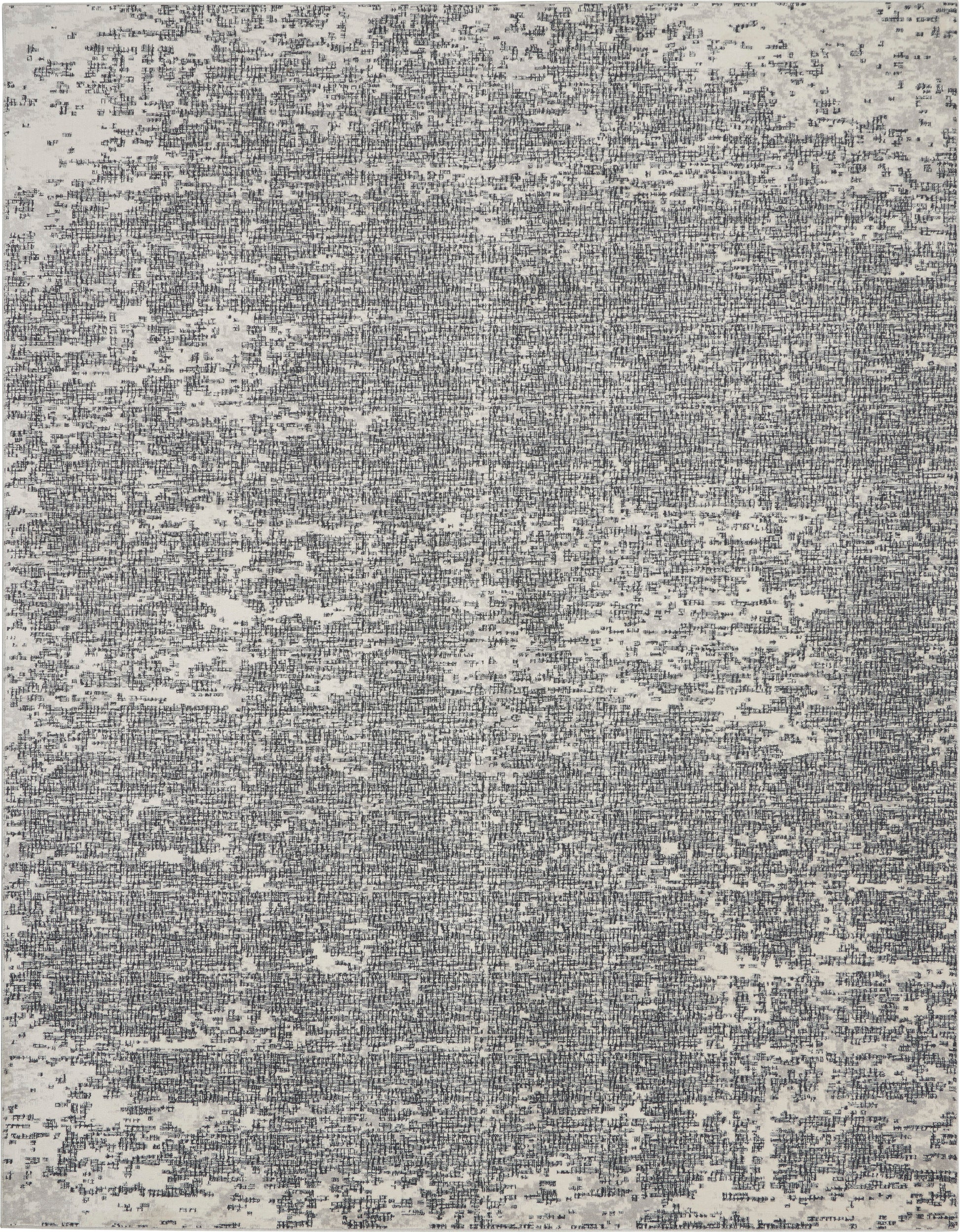 Gray and white distressed abstract rug with speckled texture; rectangular area rug.