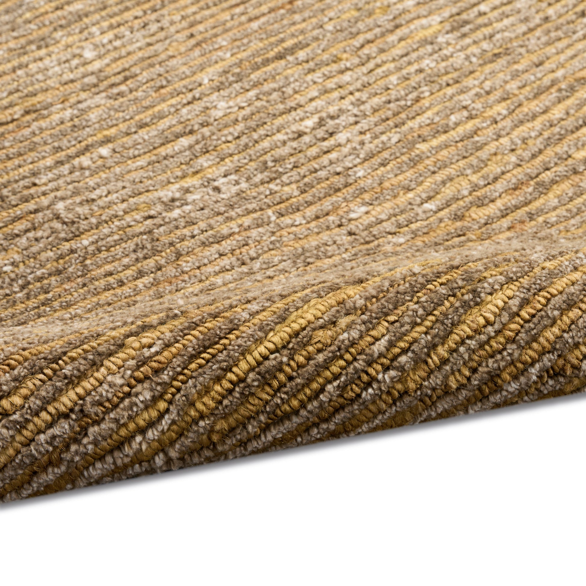 Warm beige textured rug with raised striped ridges, plush loop-pile, rolled edge.