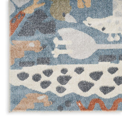 Abstract woven rug in blue, ivory, beige and orange with animal silhouettes and geometric patterns.