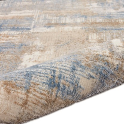 Beige and blue abstract patterned runner rug with muted geometric shapes, rolled edge, soft pile.