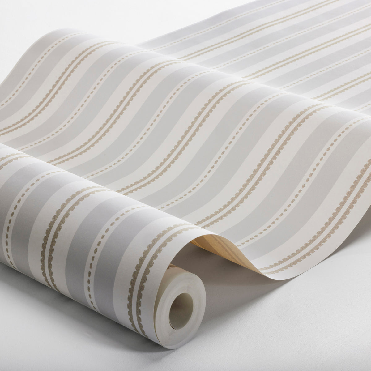 Rolled wallpaper with white base and light gray wavy stripes interspersed with beige dotted lines.