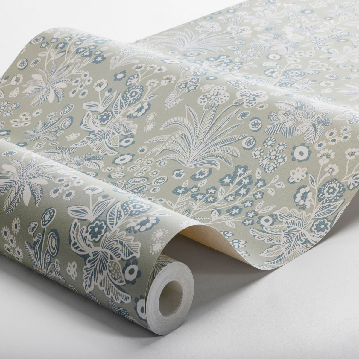 Rolled wallpaper with beige background and blue-white floral botanical print; decorative wallcovering.