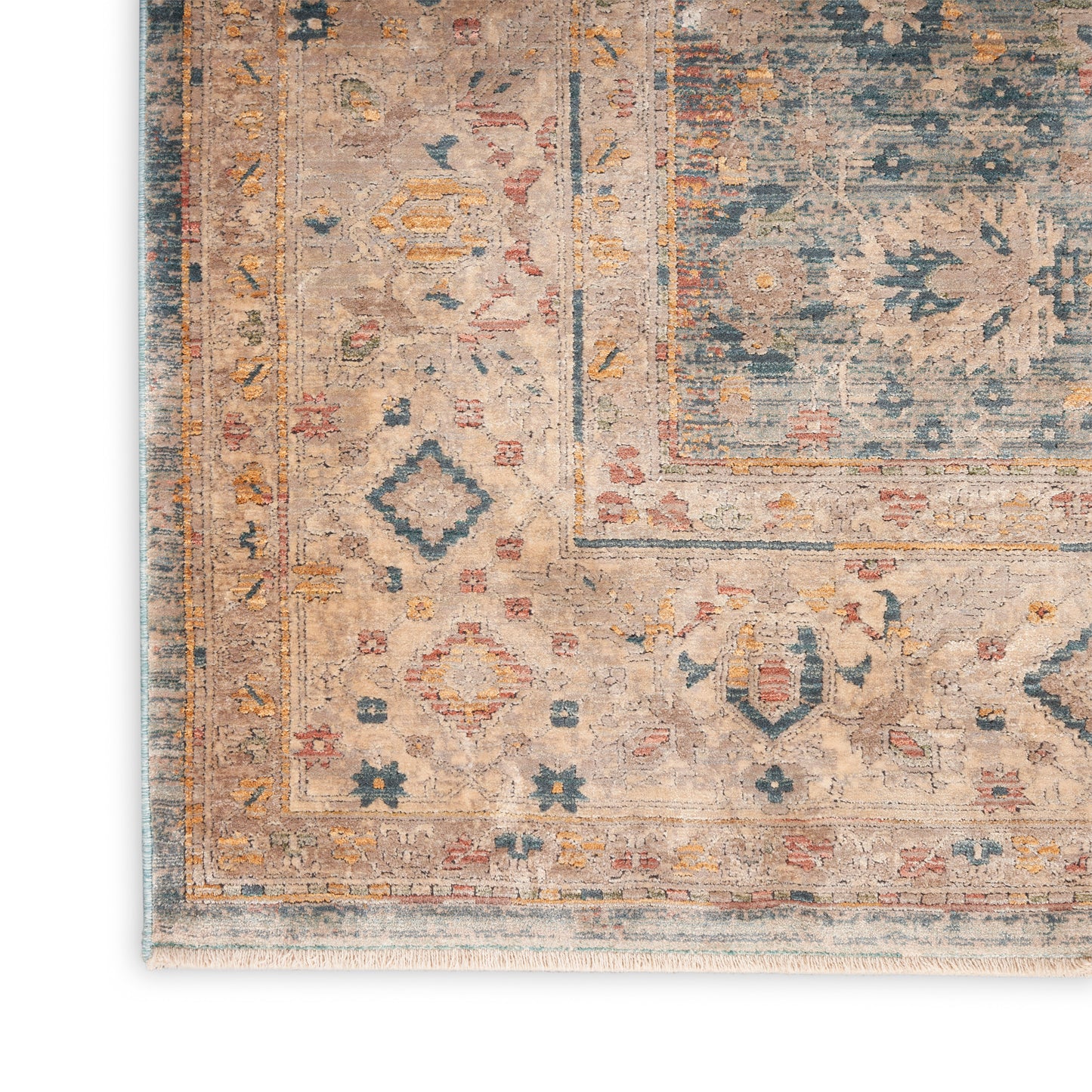 Rectangular beige oriental rug with teal, blue and rust floral motifs, layered borders and fringe.