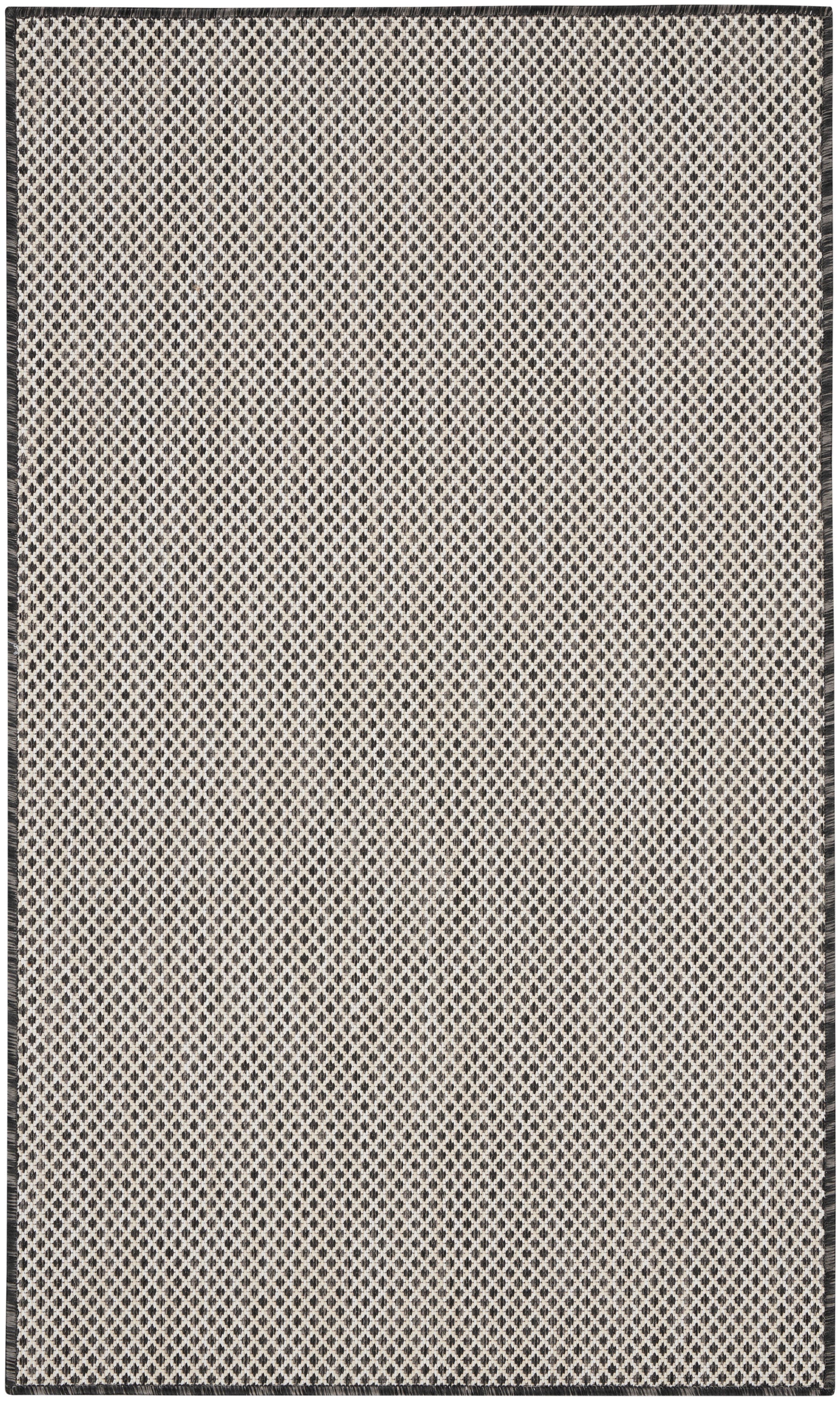 Beige flat-weave rug with tiny black diamond lattice pattern and dark border, rectangular.
