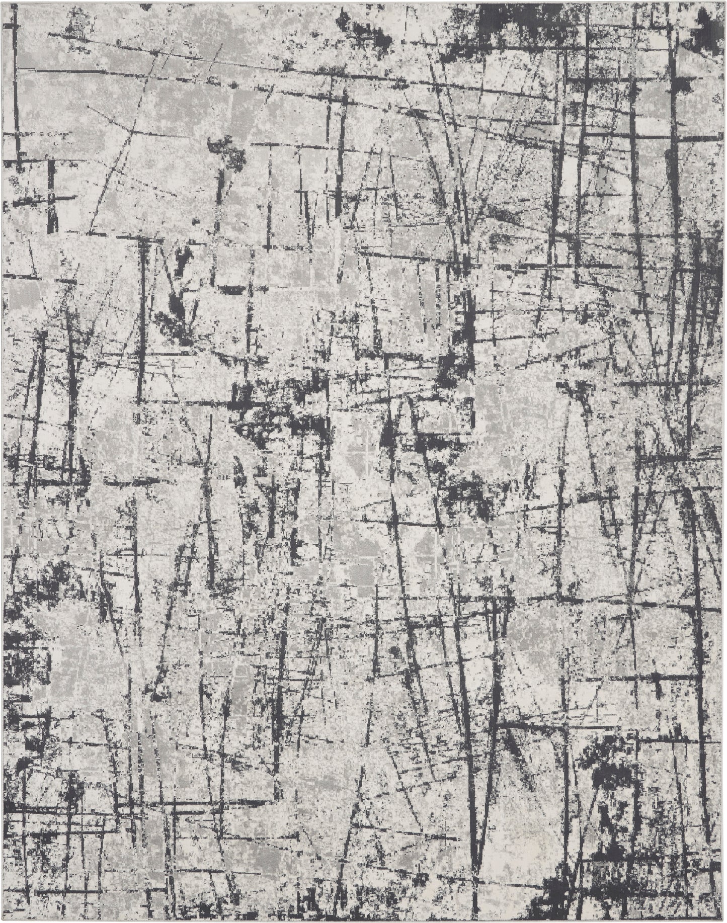 Gray and black abstract textured rug with scratch lines and crosshatch patterns.
