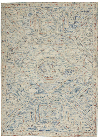 Rectangular area rug in blue & cream with rust accents; distressed geometric pattern, central medallion & diamond borders.