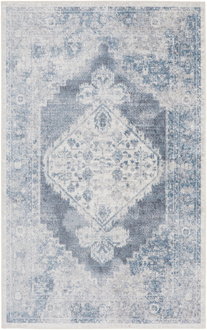 Distressed blue-gray oriental rug with a central diamond medallion and ornate floral border.