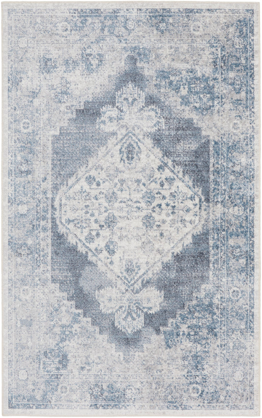 Distressed blue-gray oriental rug with a central diamond medallion and ornate floral border.