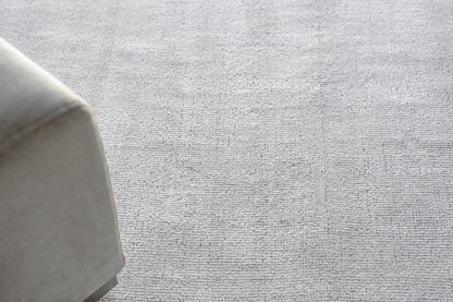 Light gray textured rug, 9' x 12'.