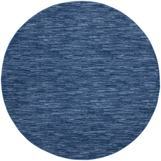 Round blue denim rug with heathered texture, soft woven floor mat.