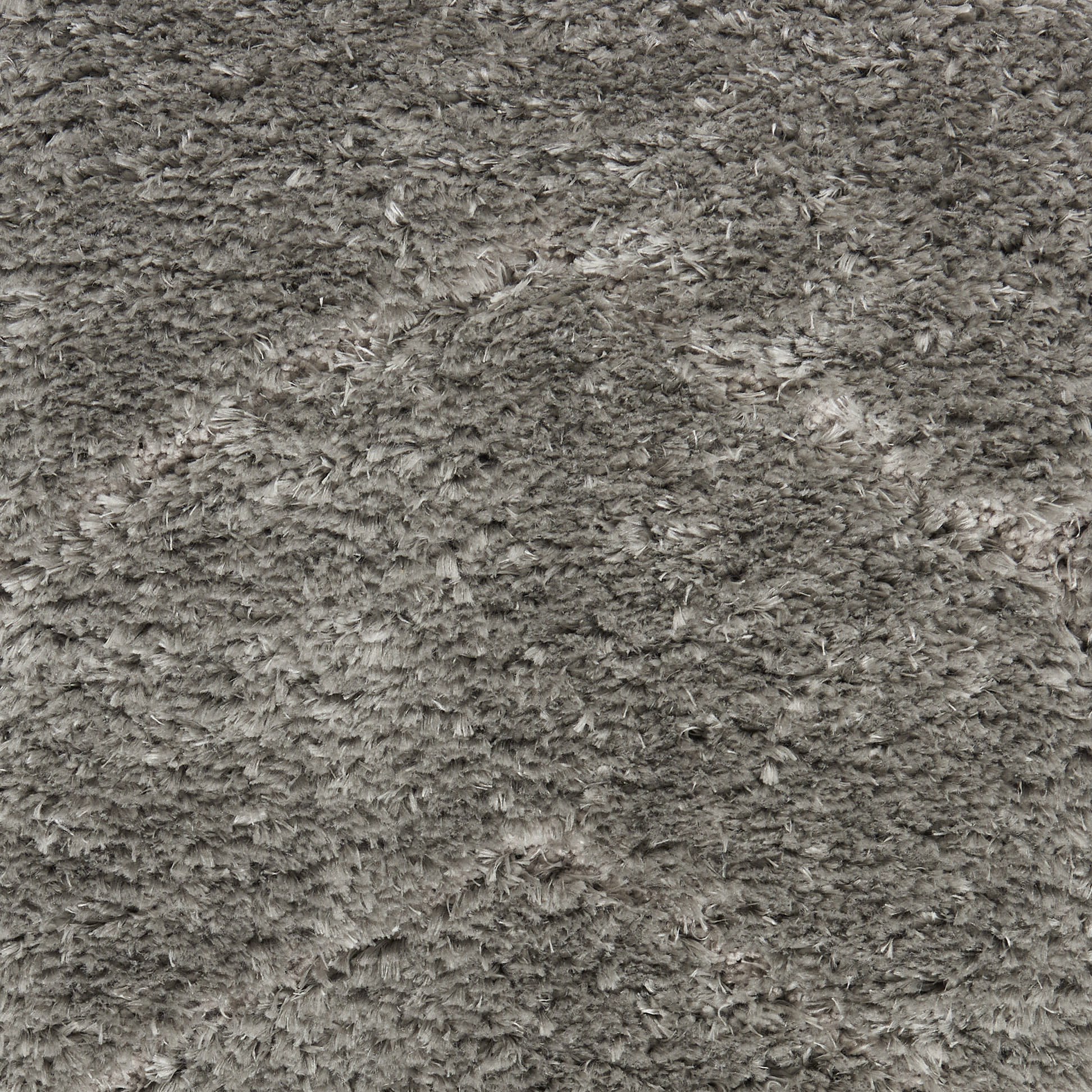 Soft, high-pile shag rug in taupe-gray with dense, fluffy fibers.