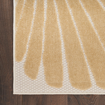 Beige outdoor runner rug with tan elongated leaf shapes on an ivory field; textured border.