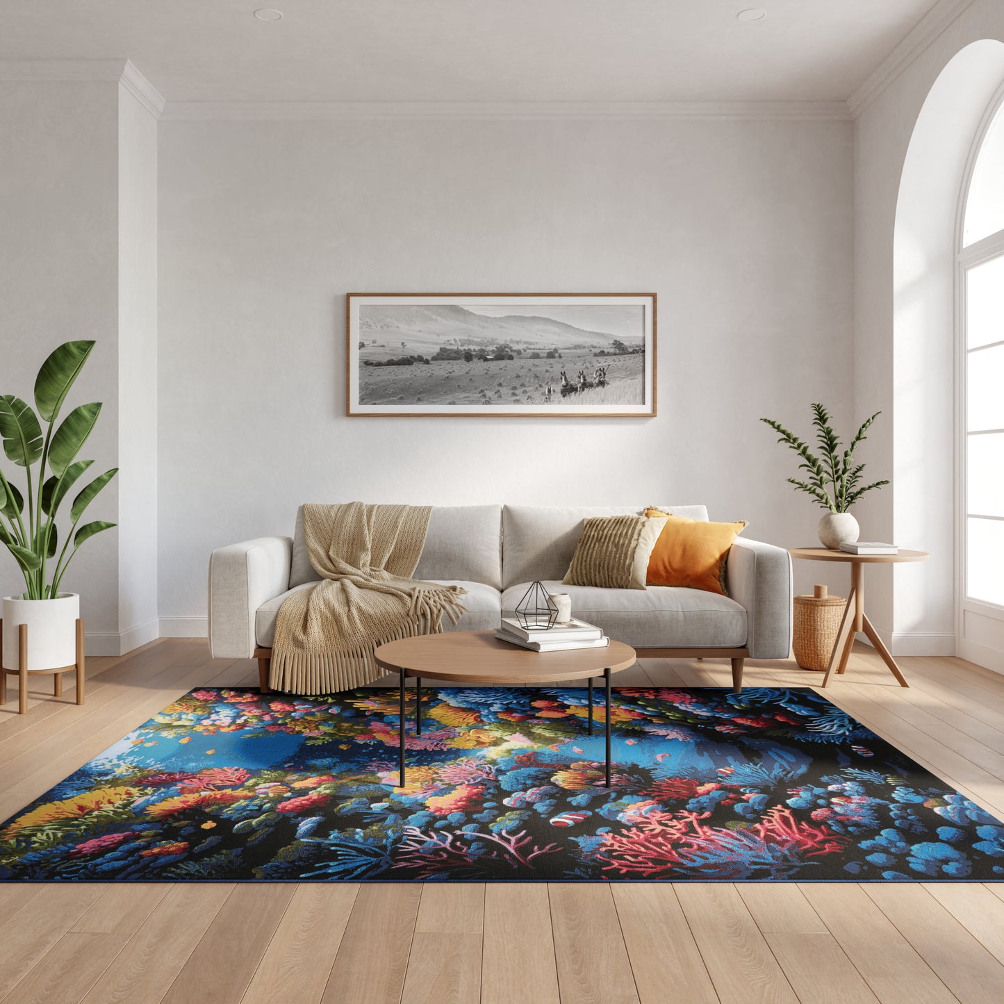 Neutral living room with sofa, beige throw and orange pillow, wood coffee table, vivid coral reef rug, plants, arched window