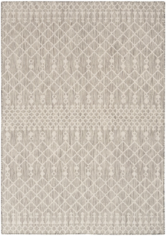 Beige woven area rug featuring a soft diamond lattice pattern with subtle horizontal band accents.