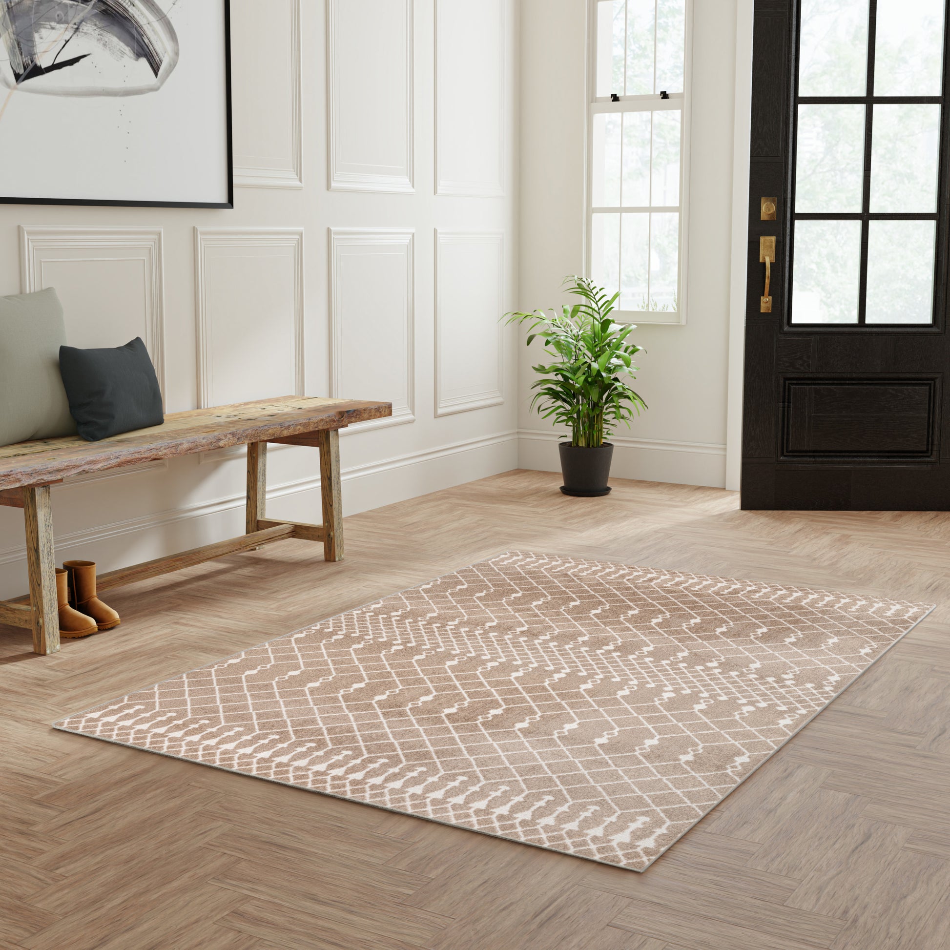 Beige 4' x 6' Bohemian area rug with white lattice pattern on light wood entryway floor.