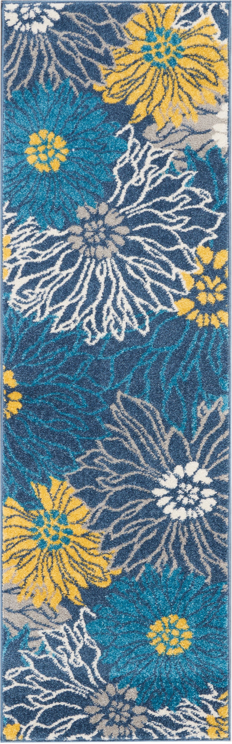 Long shaggy rug runner with large teal, white and yellow floral blooms on navy background; cozy indoor hallway decor.