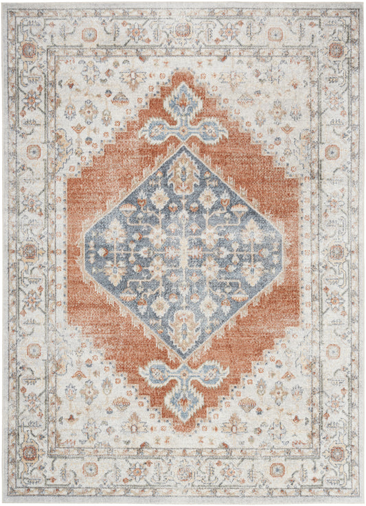 Distressed vintage oriental rug with a blue diamond medallion, rust-orange frame, ivory border and floral motifs.