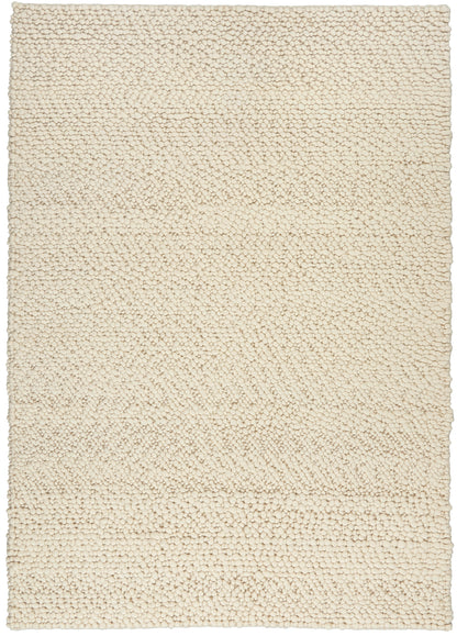 Cream boucle shag rug with dense pebble-like pile; rectangular floor covering for living spaces.