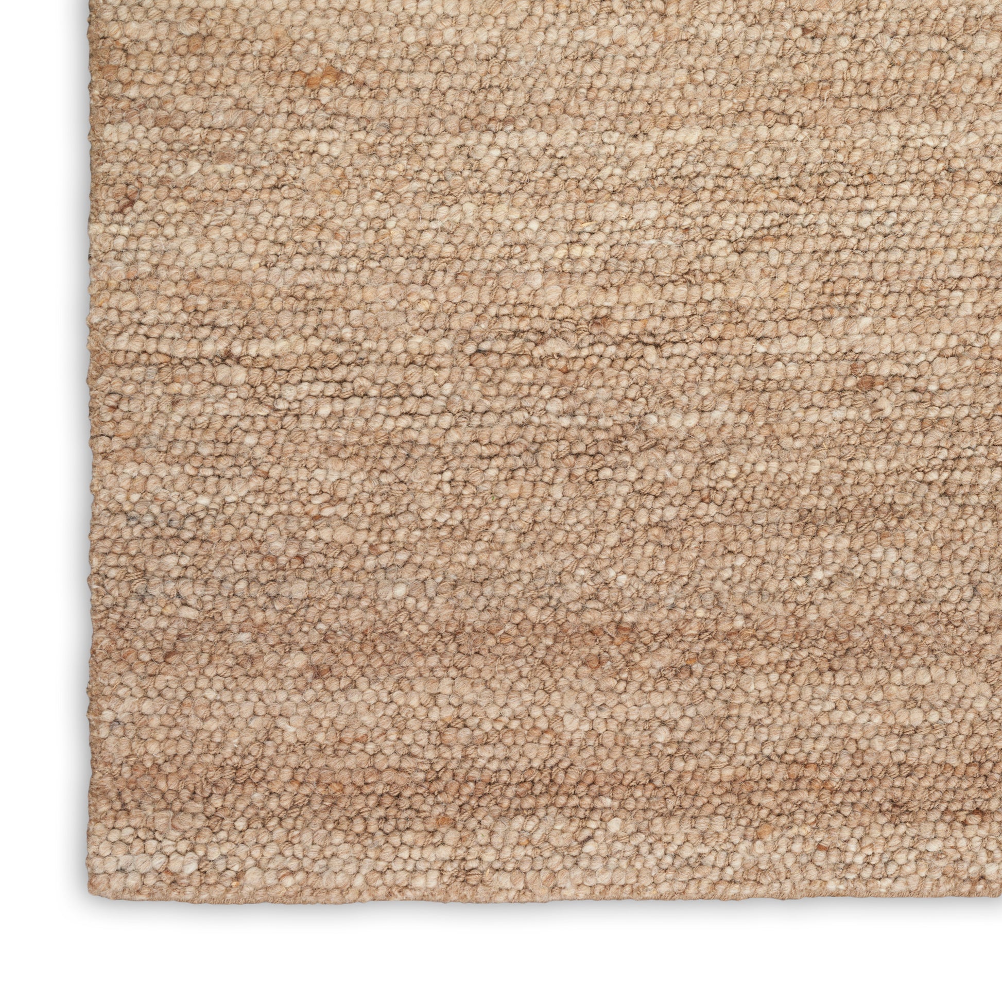Beige loop-pile rug close-up, plush textured surface in warm tan tones.