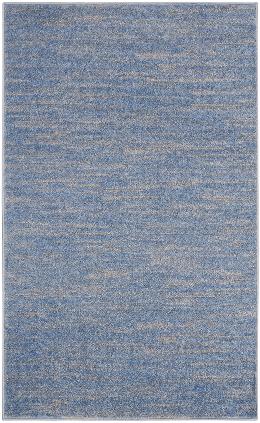 Blue and beige-speckled rectangular area rug with a soft, textured pile.