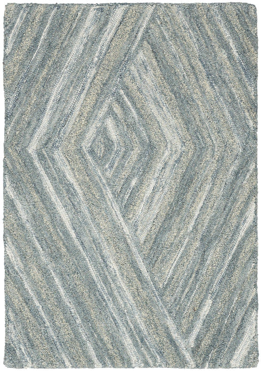 Blue-gray shag rug with a diamond-shaped geometric pattern and soft, textured pile.
