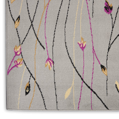 Gray runner rug with abstract black, purple & yellow vine lines and small floral accents; textured pile, corner edge visible.