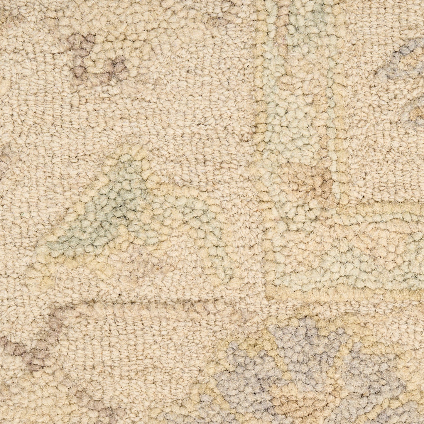 Beige textured rug with subtle geometric pattern in pale blue and yellow tones; soft tufted pile
