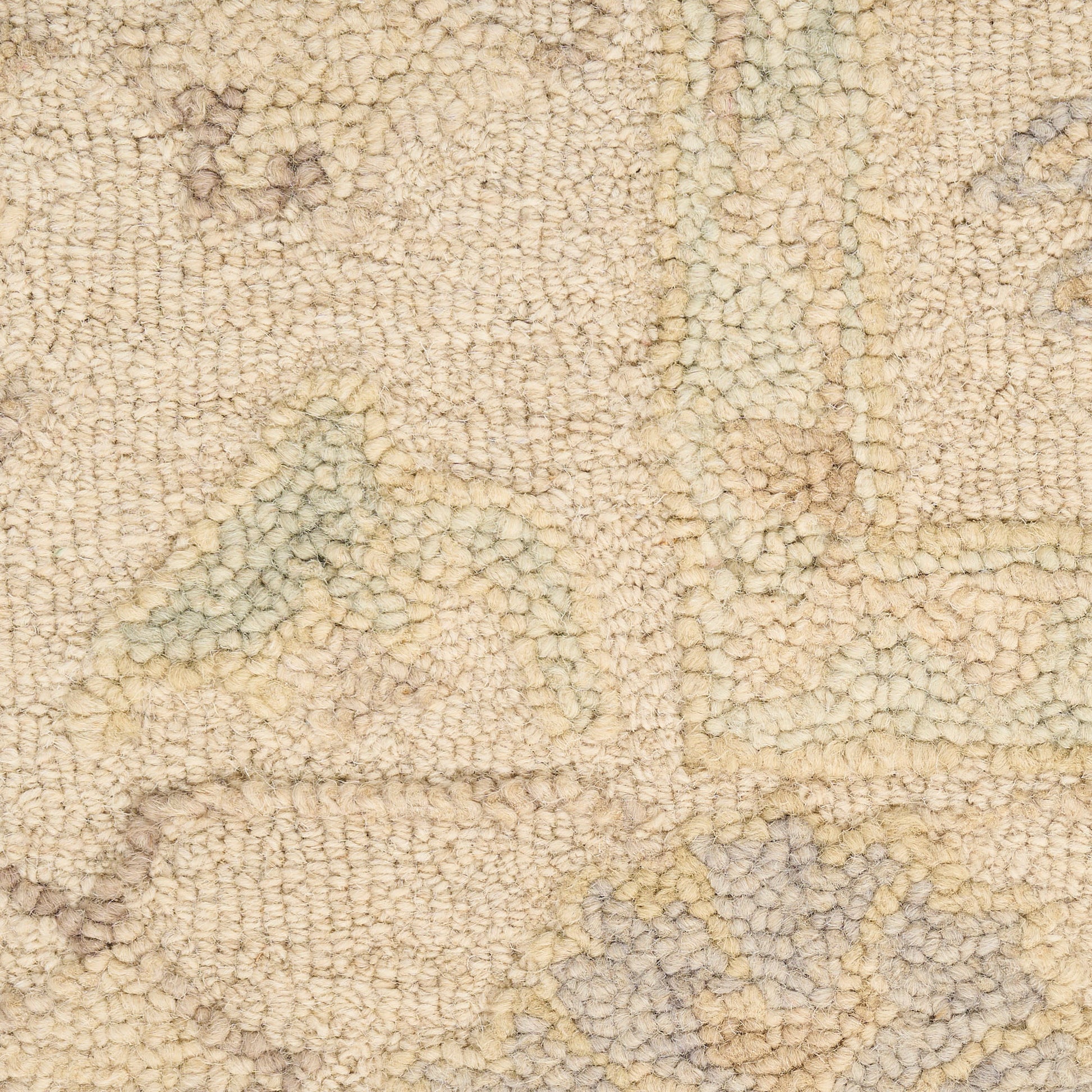 Beige textured rug with subtle geometric pattern in pale blue and yellow tones; soft tufted pile