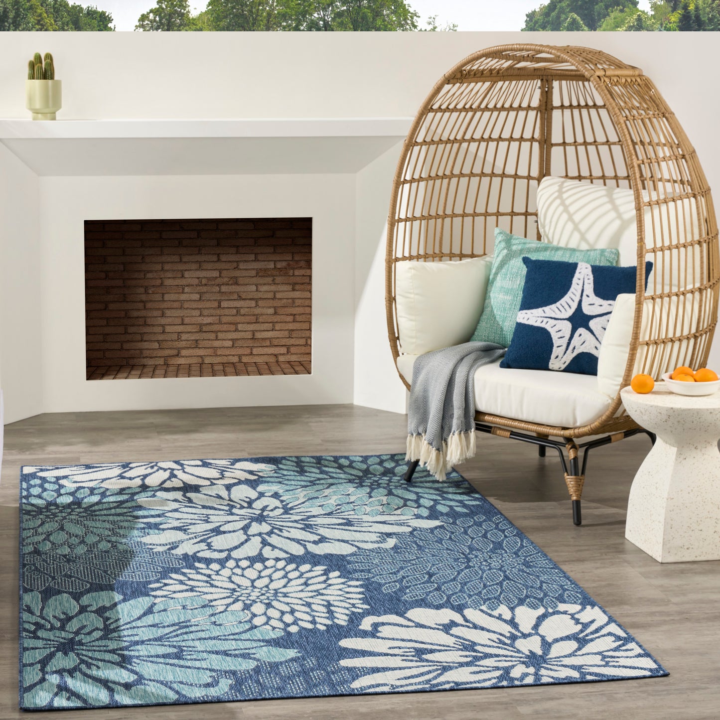 Blue floral tropical area rug in a modern living room.