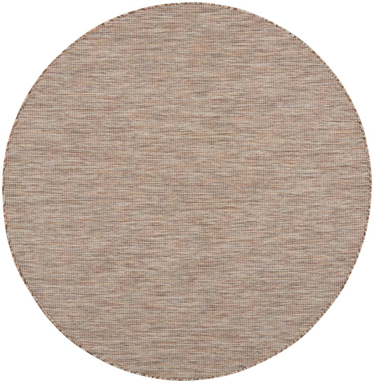 Round beige jute rug with tight woven texture, natural fibers, rustic coastal look.