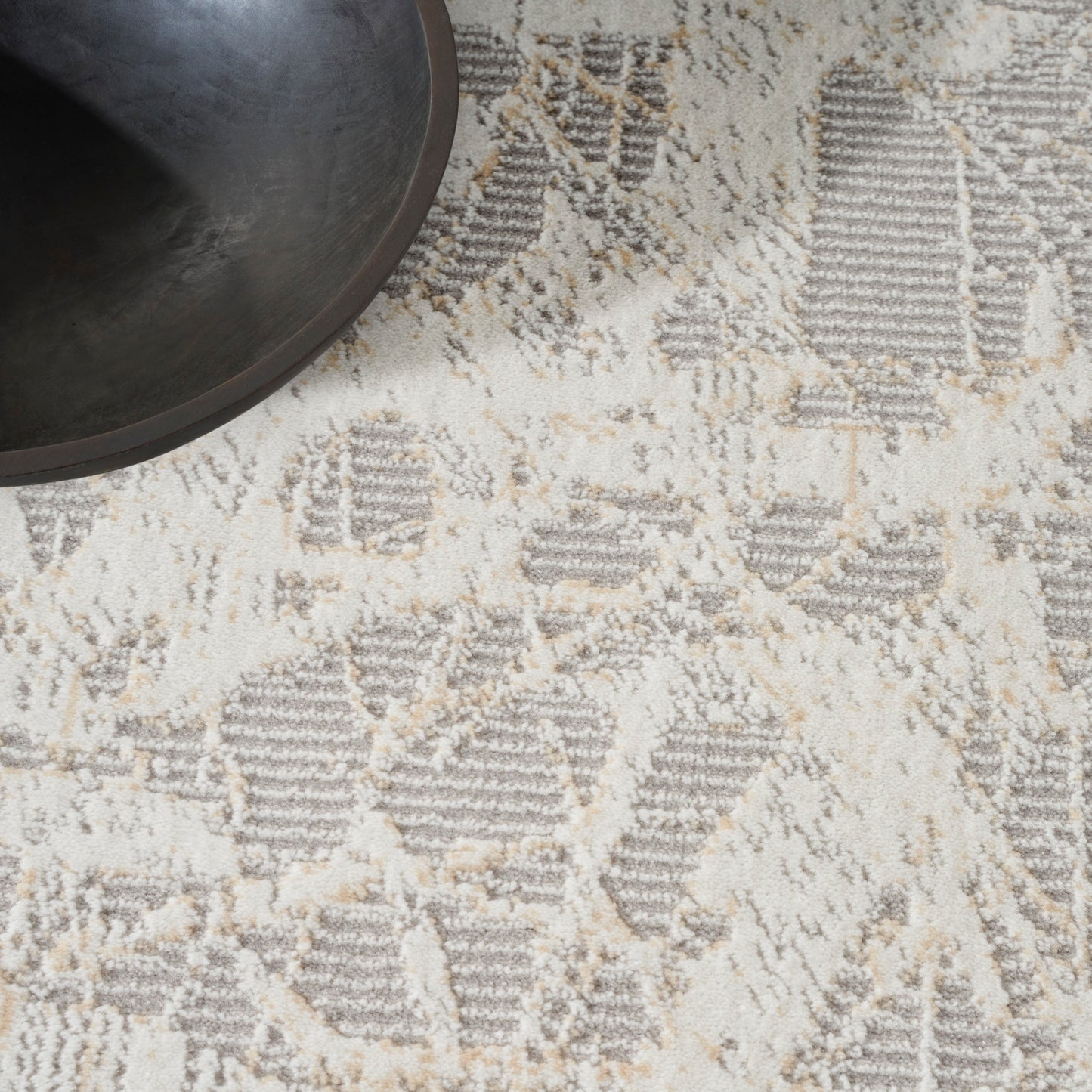 Cream-gray geometric patterned rug in a modern rustic style.