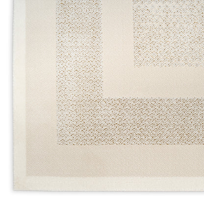 Beige woven rug with a thick textured border and subtle diamond-pattern panels in cream tones.
