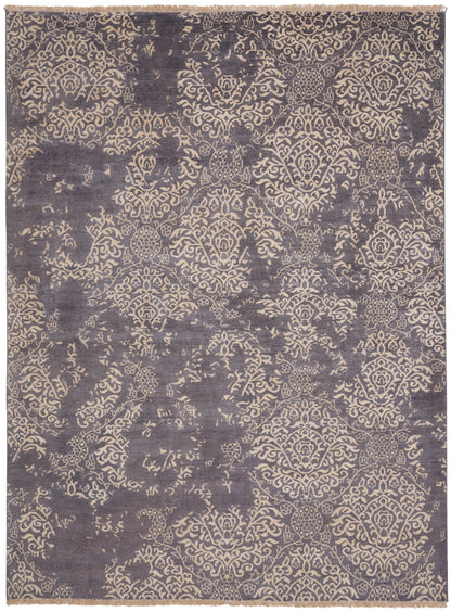 Purple indigo area rug with beige damask pattern and distressed vintage look; rectangular woven rug.