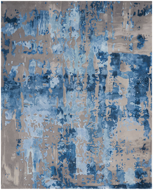 Abstract blue and tan area rug with distressed brushstroke pattern; rectangular, modern decor accent.