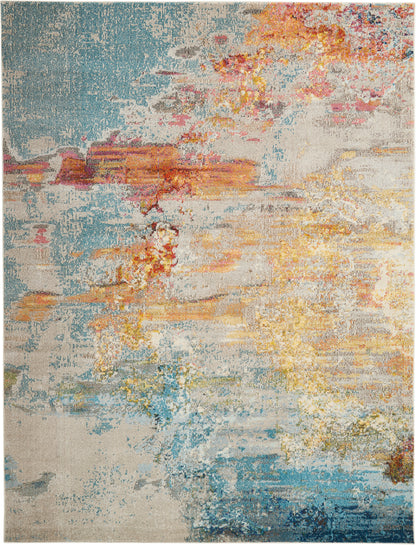 Rectangular abstract area rug with a distressed multicolor pattern in blues, beiges, yellows, pinks.