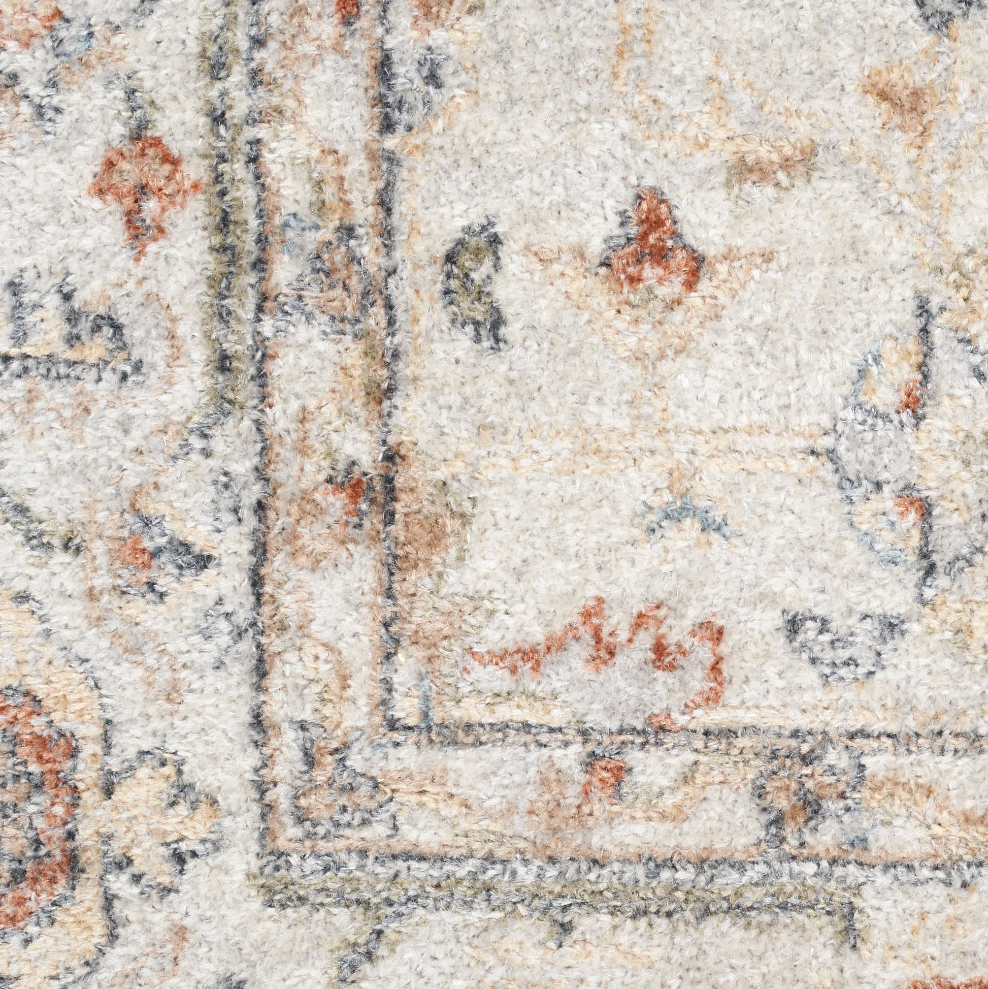 Close-up of a beige Persian-style rug with ivory field, blue-gray border, and orange floral accents.