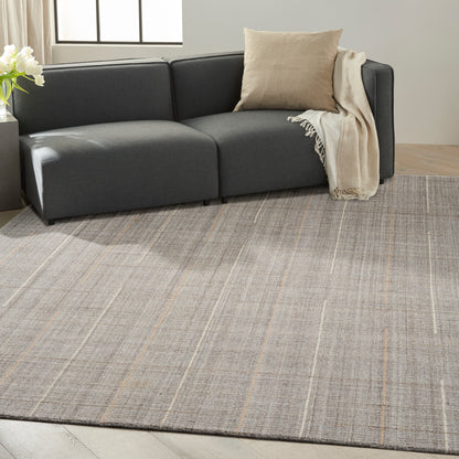 Farmhouse style rug, 10' x 14', with a light grey striped pattern in a modern living room.