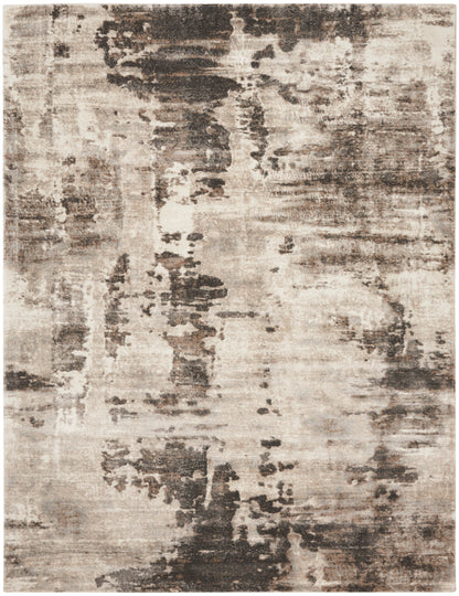 Abstract beige-brown distressed area rug with charcoal gray patches; rectangular modern living room rug