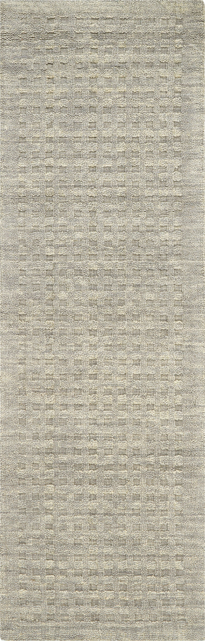 Beige textured woven rug with subtle cream grid pattern and loop pile.