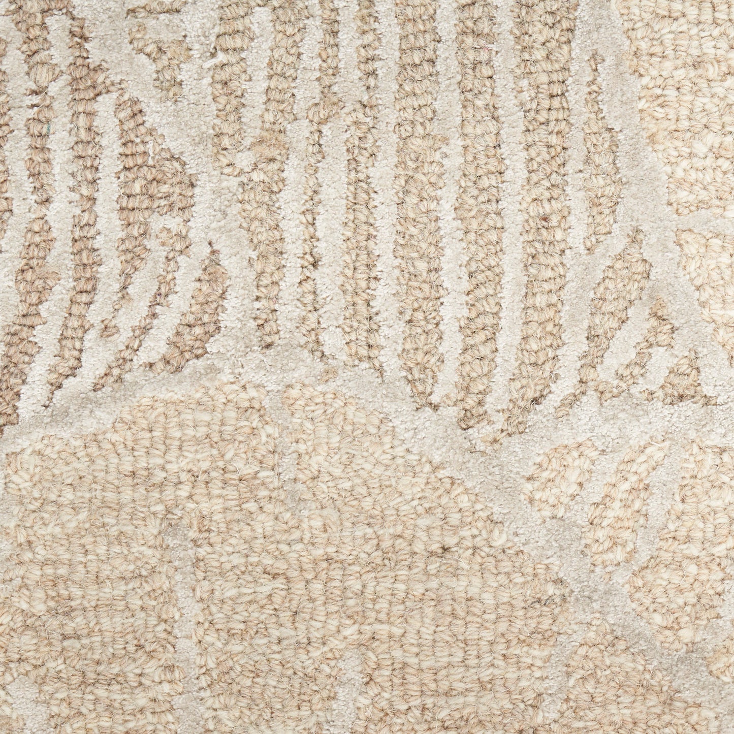 Beige plush area rug with cream geometric pattern and looped pile texture, soft neutral decor.