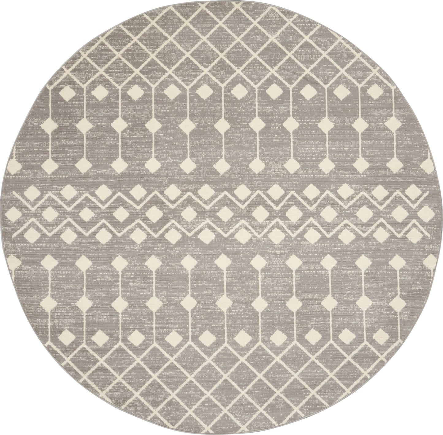 Round taupe rug with cream geometric lattice diamonds and chevron bands.