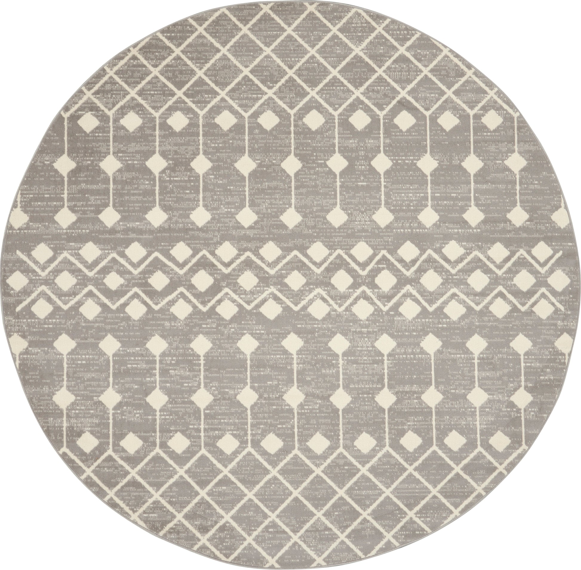 Round taupe rug with cream geometric lattice diamonds and chevron bands.
