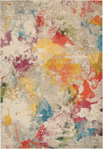Abstract multicolor area rug with beige base and irregular splashes of red, yellow, blue, and green.