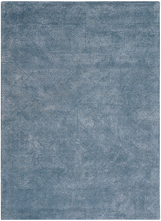 Blue textured area rug with patchwork linear patterns in denim tones; plush decorative floor covering.