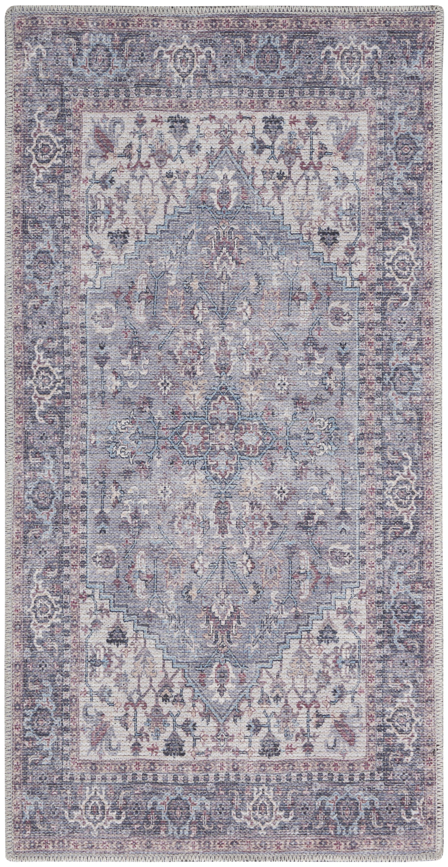 Rectangular Persian-inspired rug in muted blue-lavender tones with rose accents and fringe.