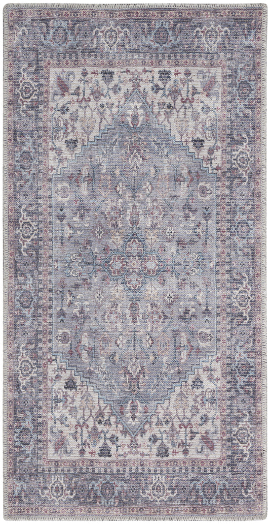 Rectangular Persian-inspired rug in muted blue-lavender tones with rose accents and fringe.
