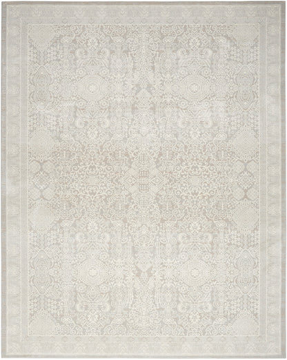 Cream-toned area rug with pale, intricate symmetrical pattern and ornate border; traditional Persian/Oriental style.