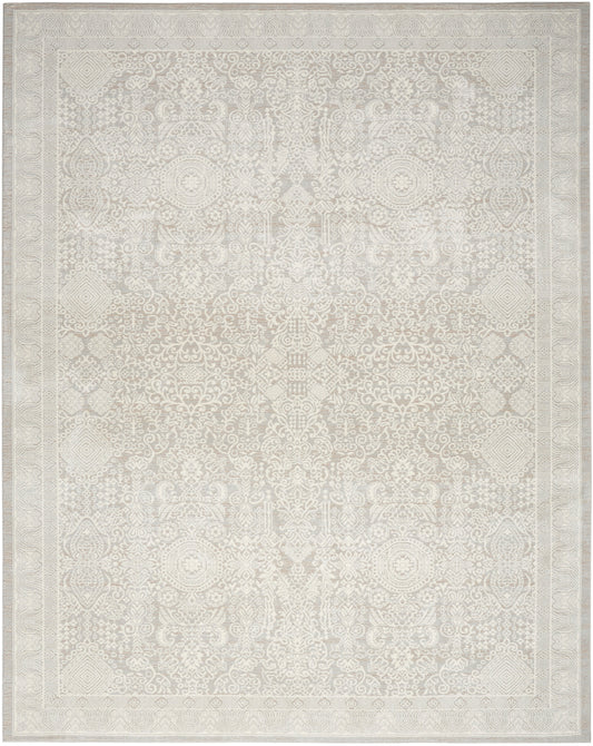 Cream-toned area rug with pale, intricate symmetrical pattern and ornate border; traditional Persian/Oriental style.