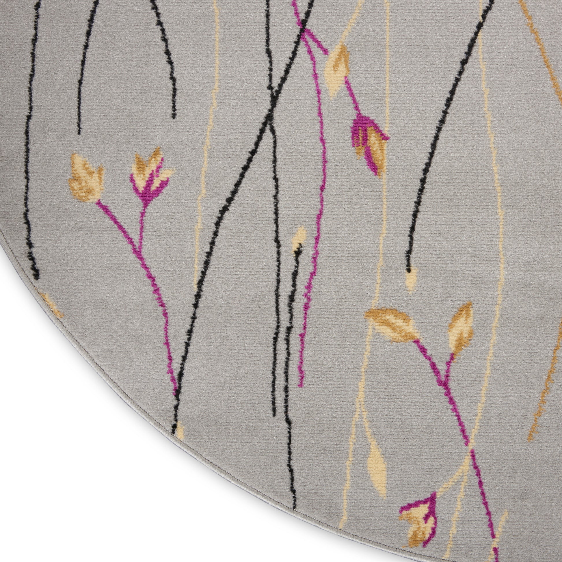 Round gray rug with abstract vertical vines in black, magenta and beige with yellow leaf accents.
